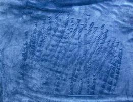 Blue, textured and fleecy fabric in soft carpet and velor for the exterior of furniture. Blank homogeneous material texture and background blank. Copy space. photo
