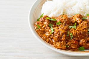 chicken tikka masala with rice on plate photo