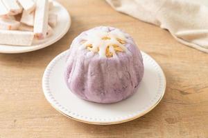 taro bun with white sugar cream and nut photo