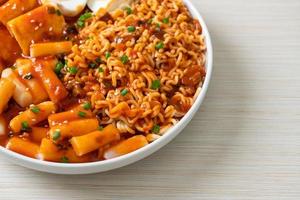 Korean instant noodles with Korean rice cake and fish cake and boiled egg photo