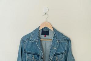 jacket jean hanging with wood hanger photo