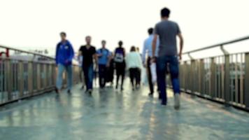 People crossing footbridge in istanbul, walking on way, selective focus, noise effect video