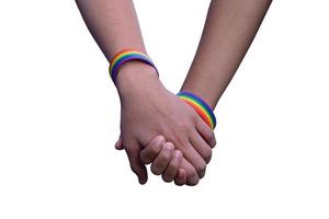 Isolated hands which wear rainbow wristband around them with clipping paths. photo