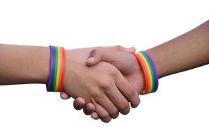 Isolated hands which wear rainbow wristband around them with clipping paths. photo