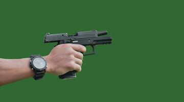 Isolated 9mm pistol gun holding in right hand of gun shooter with clipping paths. photo