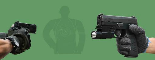 Isolated 9mm pistol gun holding in right hand of gun shooter with clipping paths. photo