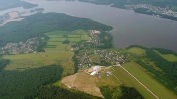 Passenger airplane descending for landing. POV view of the city, forests and rivers video