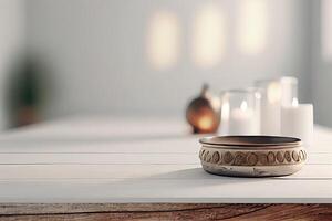 Spa stones, towel and candles on color background. Spa composition and treatments on light wooden background, close-up. photo