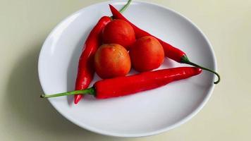 rotating display of tomatoes and chilies. very beautiful and can be used as much video