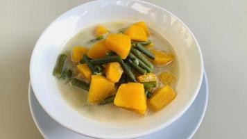 Vegetable coconut milk is a typical Indonesian food. made from pumpkin, long beans and coconut milk. video