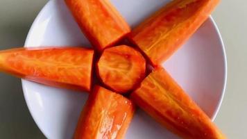 papaya pieces on a rotating plate, very healthy and delicious to eat in the morning. with zoom effect video