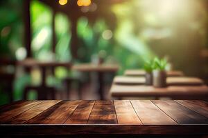 image of wooden table in front of abstract blurred background of resturant lights. Wood table top on blur of lighting in night cafe,restaurant background. selective focus. photo