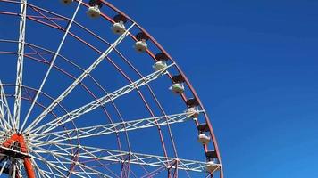 Ferris wheel with blue sky and cloudy background video