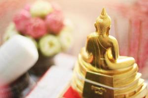 Behide golden Buddha statue in the temple photo