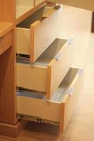 Open the modern cabinet drawer in furniture shop photo