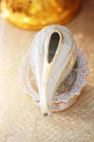 Conch shell on glod tray in tradition Thai wedding ceremony photo