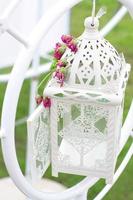 White Birdcage decoration in the wedding ceremony photo