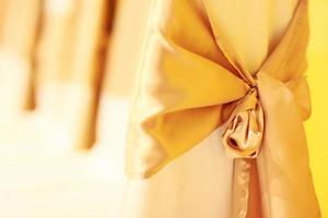 Beautiful chairs decoration with ribbon in wedding event hall, selective focus. photo