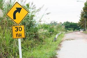 30 kilometers Right Curve Ahead Sign on the mountain photo