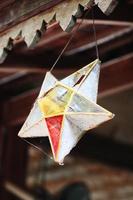 Antique Vintage shape star Lantern light lamp hanging and decorative in the garden resort and house in Thai Lanna style in northern thailand photo