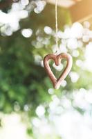 Shape wooden heart hanging on ceilng decorate in wedding ceremony. Valentine day Concept photo