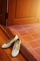 Bride shoes on wooden floor. Wedding shoes photo