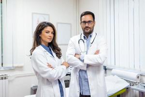 Portrait of two confident young doctors working in a hospital photo