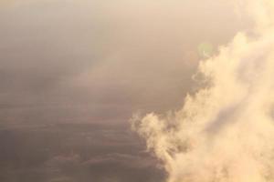 Golden light with sunrise in morning on the sky and cloud on the mountain. Fog cover the jungle hill in Thailand photo