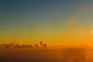 Golden light with sunrise in morning on the sky and clound .Fog cover the jungle hill in Thailand photo