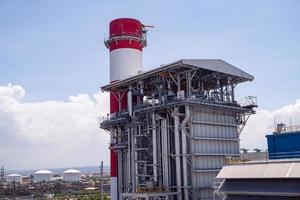 Landscape photo of chimney and stack of combine cycle power plant project. The photo is suitable to use for industry background photography, power plant poster and electricity content media.