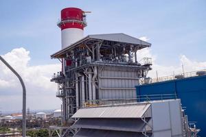 Landscape photo of chimney and stack of combine cycle power plant project. The photo is suitable to use for industry background photography, power plant poster and electricity content media.