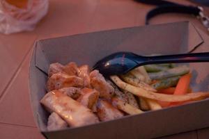 Fried chicken steak with fired fries bean and barbeque black paper sauce. The photo is suitable to use for food background, poster and food content media.