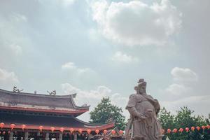 Traditional chinese guardian gate statute on the chinese temples when chinese new years. The photo is suitable to use for chinese new year, lunar new year background and content media.