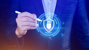 Computer network protection, secure and safe your data concept, businessman holding shield protection icon, Security shield Lock Security Businessman Protect Concept photo