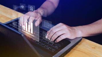 Big data analytics and business intelligence BI concept with chart and graph icons on digital screen interface and business people in the background. photo