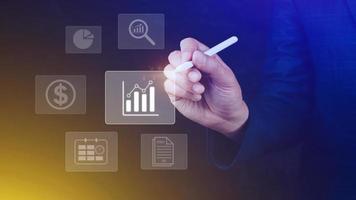 Big data analytics and business intelligence BI concept with chart and graph icons on digital screen interface and business people in the background. photo