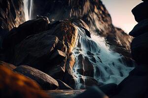 close-up view of stream waterfall. Waterfall close-up background. Water falling on the rocks in close up. . photo