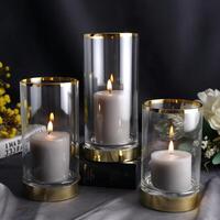 Cylindrical glass candle on cup light gray glass gold photo