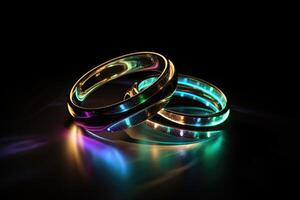 Two wedding rings made of light and energy created with technology. photo