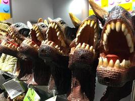 Dinosaur Toys on shelf in supermarket for background, Batam,Indonesia-April,2023 photo