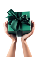 Top view gift box with green ribbon bow in female hands. isolated transparent background. png