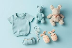 Baby accessories concept. Top view photo of baby clothes with empty space on isolated pastel background.