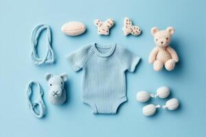 Baby accessories concept. Top view photo of baby clothes with empty space on isolated pastel background.