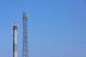 Cell towers against the blue sky. Business background photo
