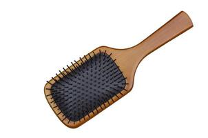 Bamboo Paddle Hair Brush isolated on white background with clipping path photo