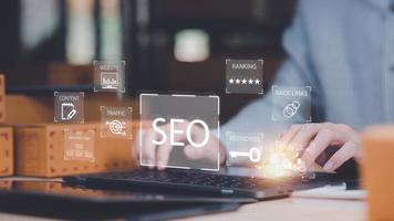 Marketer showing SEO concept ,optimization analysis tools , search engine rankings , social media sites based on results analysis data ,Website Search Optimization ,online marketing strategy photo