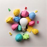 new idea concept with crumpled office paper and light bulb. Inspiration concept crumpled paper light bulb metaphor for choosing the best idea. . photo