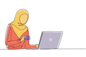 Continuous one line drawing young Arab woman typing entering credit card code on laptop around desk. Digital lifestyle, e-commerce, payment concept. Single line draw design vector graphic illustration