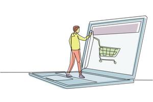 Single continuous line drawing young male shopping online via giant laptop screen with shopping cart inside. Sale, digital lifestyle concept. Dynamic one line draw graphic design vector illustration