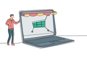 Single continuous line drawing young man inserting credit card into canopy laptop screen with shopping cart. E-shop, digital payment concept. Dynamic one line draw graphic design vector illustration